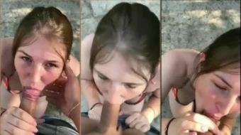 Adolecente realizando sexo oral en la playa